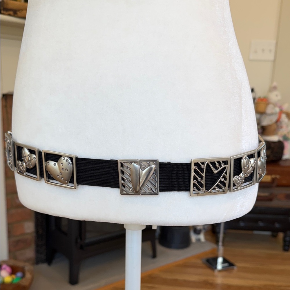 Chico’s slvtn heart and graphic design plates attached to a black stretch band.